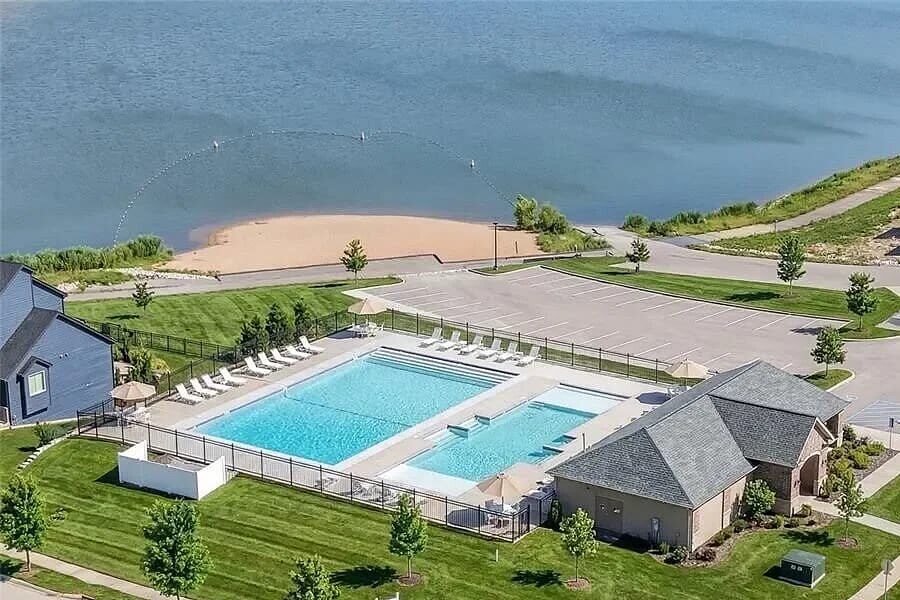 Aerial view of the Cottleville Trails community pool, clubhouse, and lake