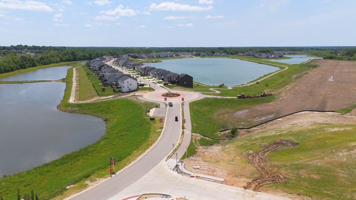 Aerial drone view of Cottleville Trails community entrance and lakes